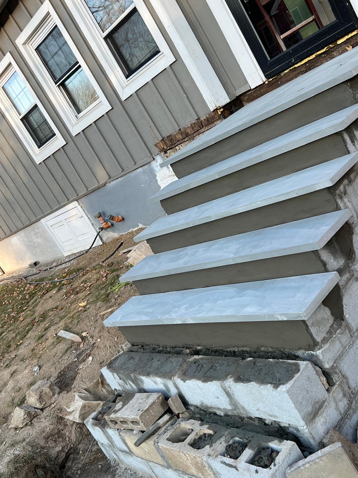 Finished bluestone entry steps with concrete block foundation