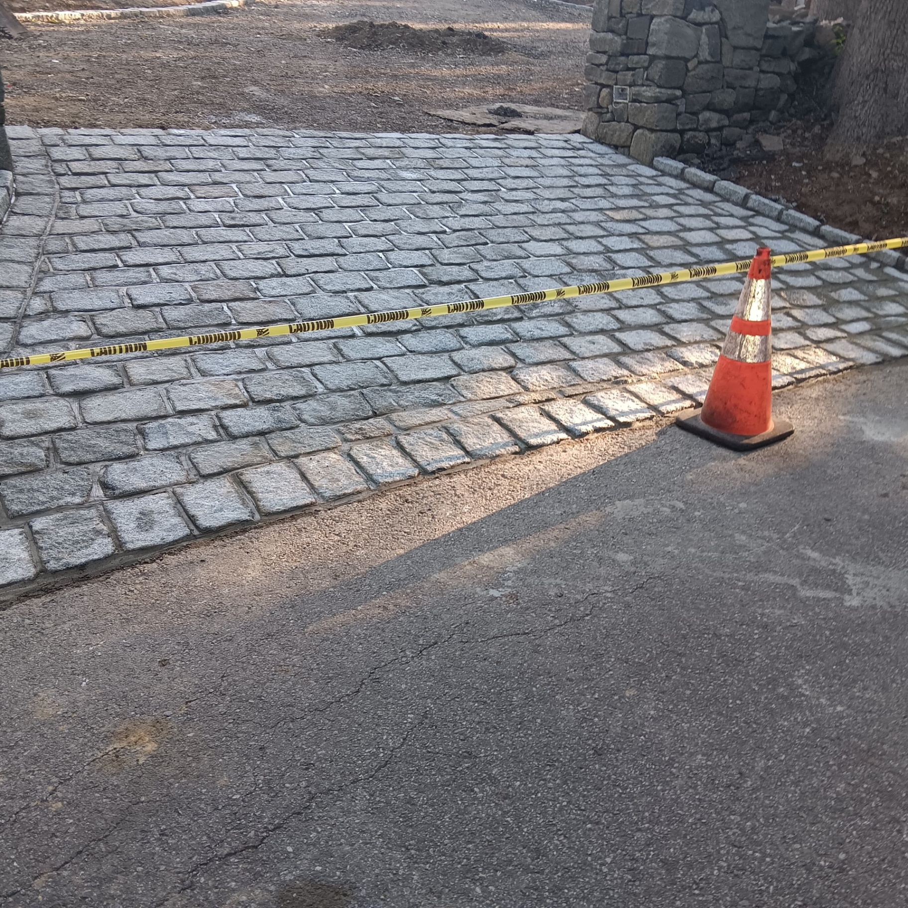 Granite cobblestone driveway installation