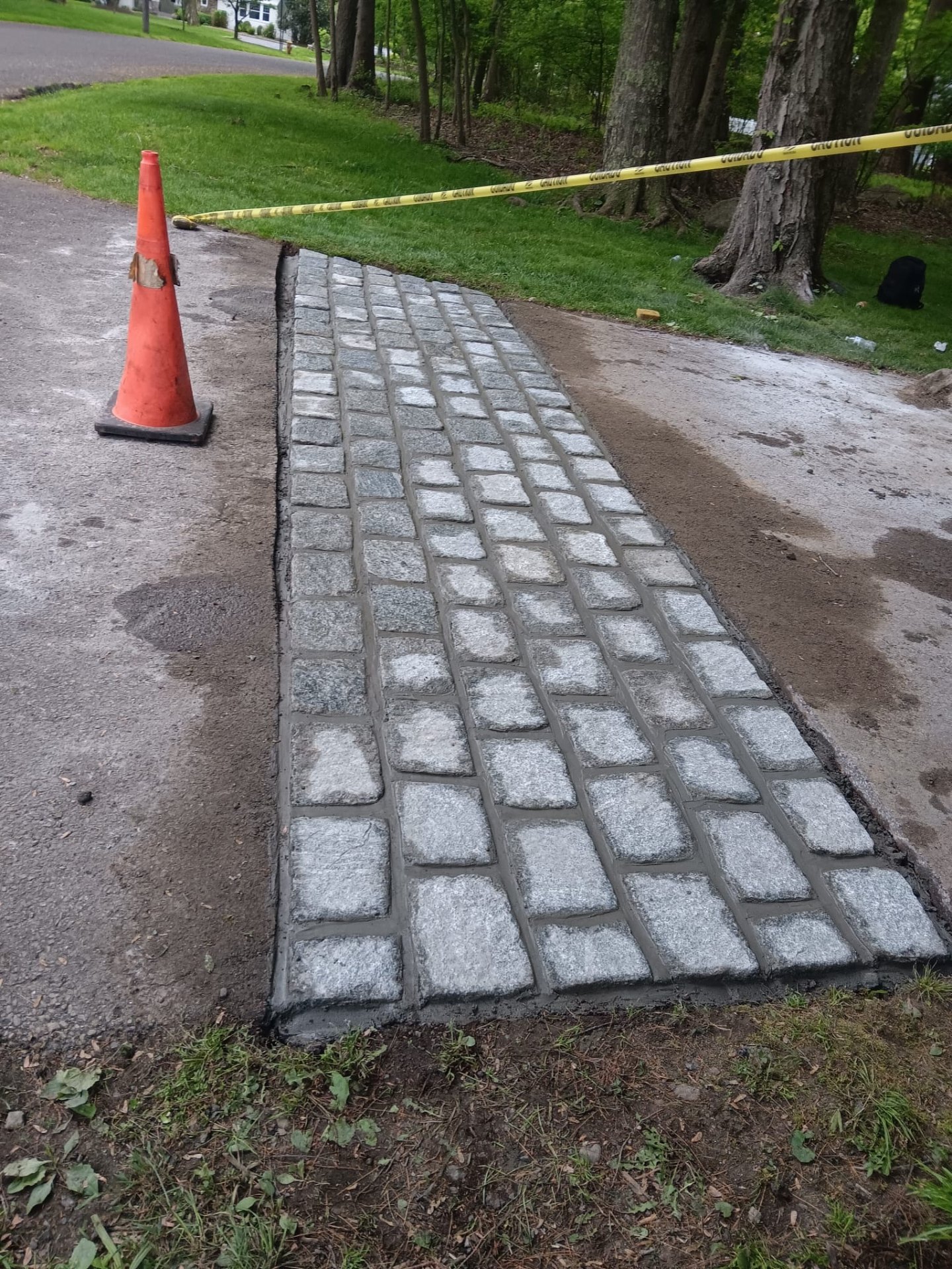 Cobblestone driveway apron installation