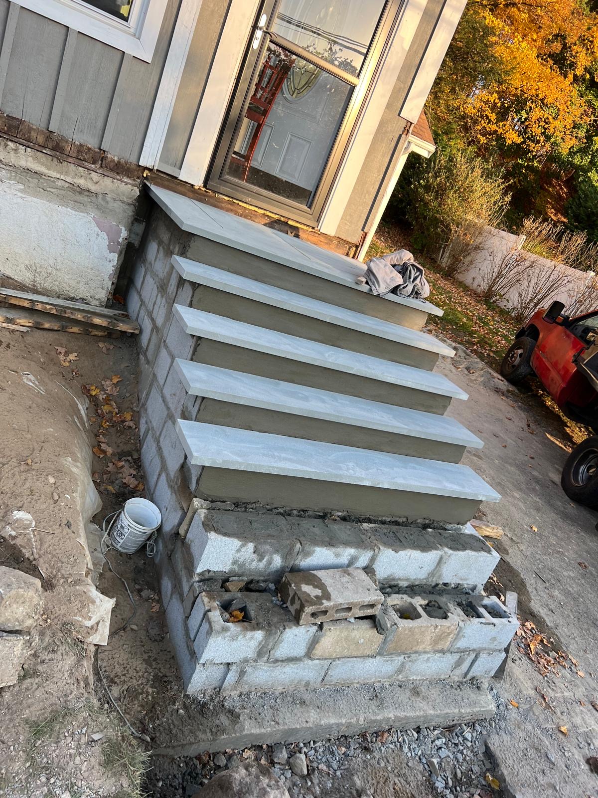 Completed masonry front steps and entry foundation