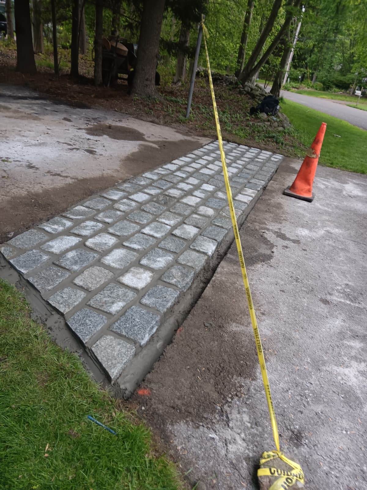 Completed granite block apron across driveway entrance