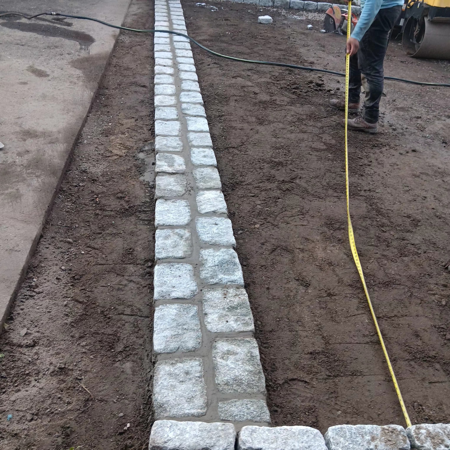 Granite curb line installation with layout measurements